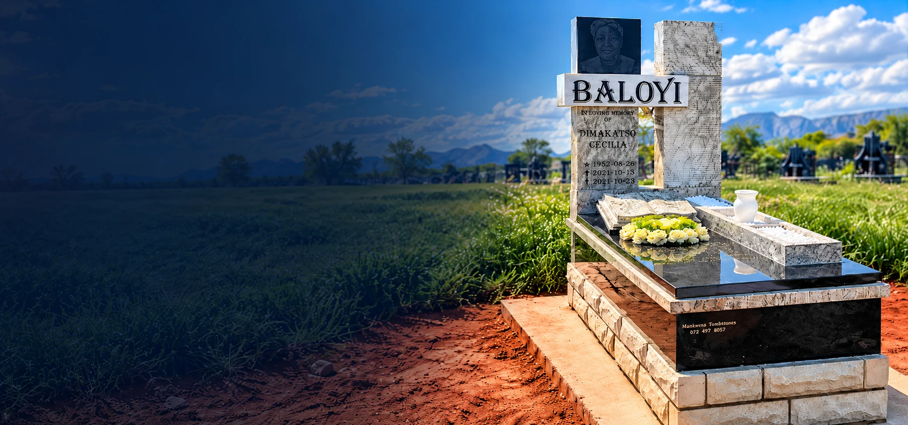 A granite tombstone with a cross and portrait plaque, installed in a cemetery